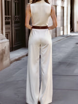 Tuta senza maniche a gamba larga con bottoni asimmetrici